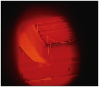 Inside a furnace during a fire test on a spray protected beam
