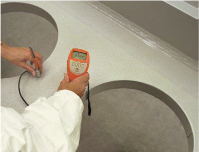 Off-site applied thin film intumescent coating being checked