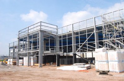 Each store has a connected steel-framed entrance pod