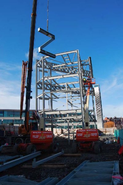 Z-shaped bracing is lifted into place