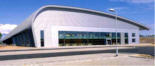 Modern industrial building with curved steel roof