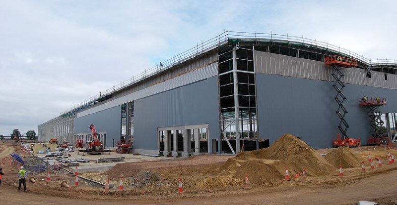 Cladding installation follows on behind the steel erection programme