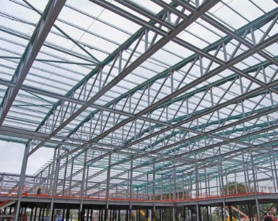 A series of 45m-long trusses spans the sports hall
