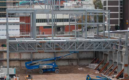 A series of 26m long trusses are installed to form the delivery yard