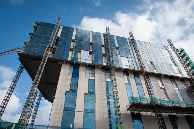 The building is topped by a feature cantilevering three-storey lantern