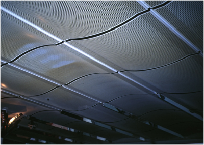 A permeable ceiling of the type which will hide a soffit while allowing the mass of the floor to be mobolised