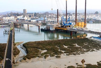 During construction of the new bridge, the old crossing (left) was used for access and transporting materials across the river