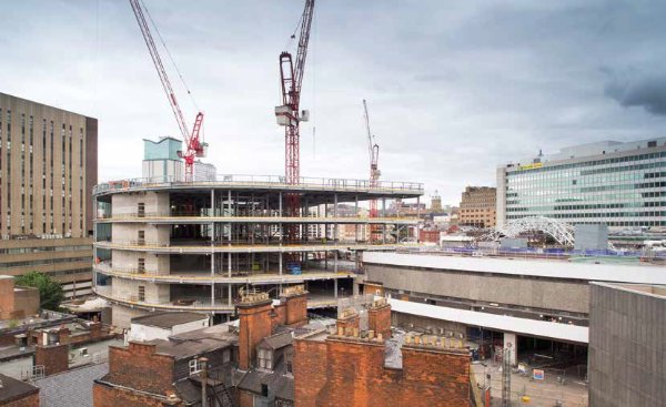 The John Lewis store takes shape while the steel trusses for the redeveloped station (right of picture) are assembled in readiness for erection