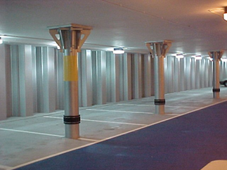 Circular columns in a basement car park supporting a concrete flat slab by use of fabricated shear heads