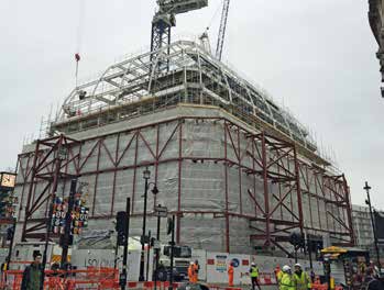 The new feature roof rises up above the retained elements