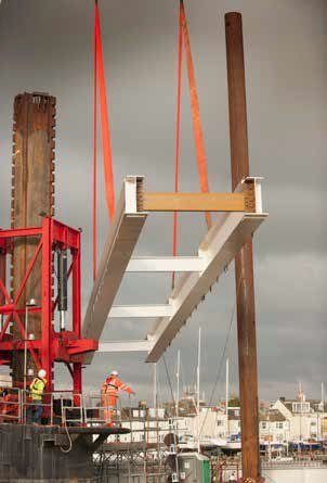One of the bridge spans is lifted into place