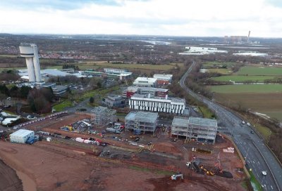 Positioned at the entrance to the campus, the three buildings are designed as a signpost to the development