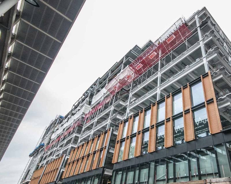 The building is clad in terracotta and glass