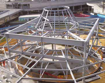 A steel and glass ‘lantern’ structure rises from level 5 of the civic drum