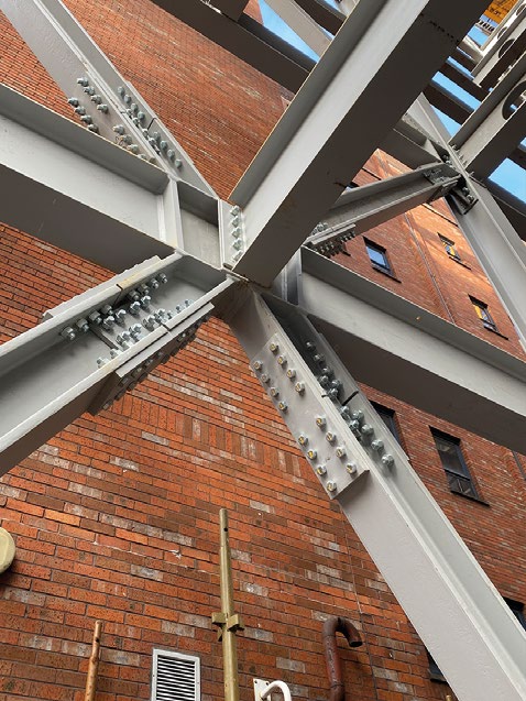 A combination of bracings and connections back to the main core provide the stability for the steel frames