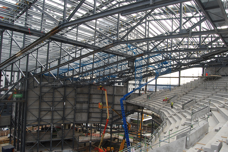 Steel rakers support the terracing units of the arena