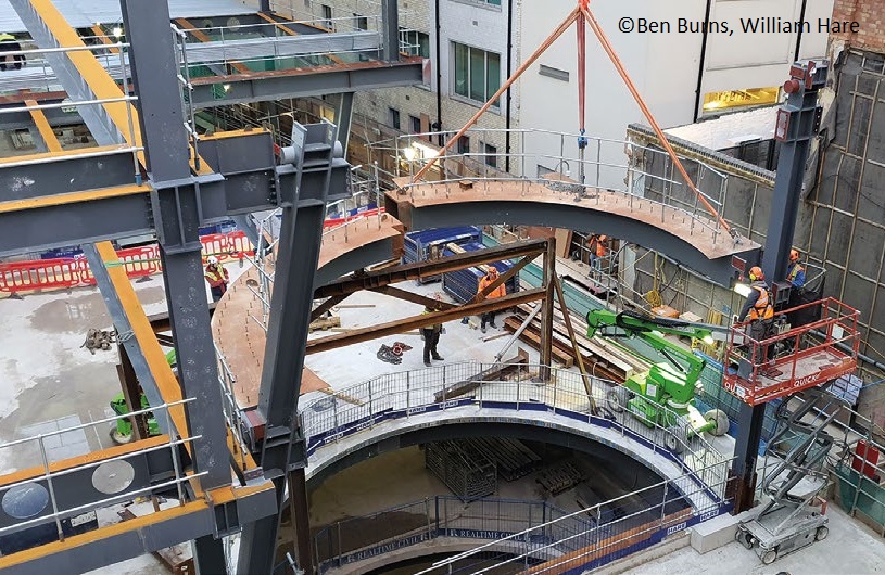 A 'spotlight' atrium is formed with curved members