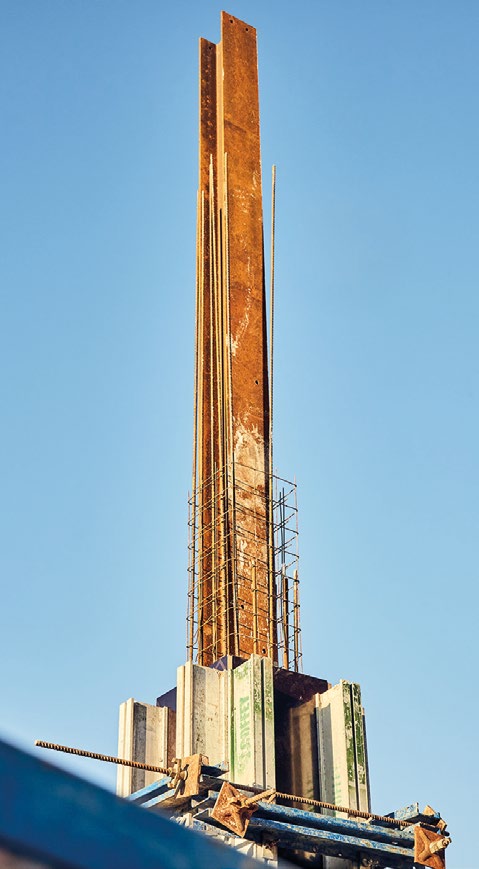 A steel column is erected prior to being encased in concrete