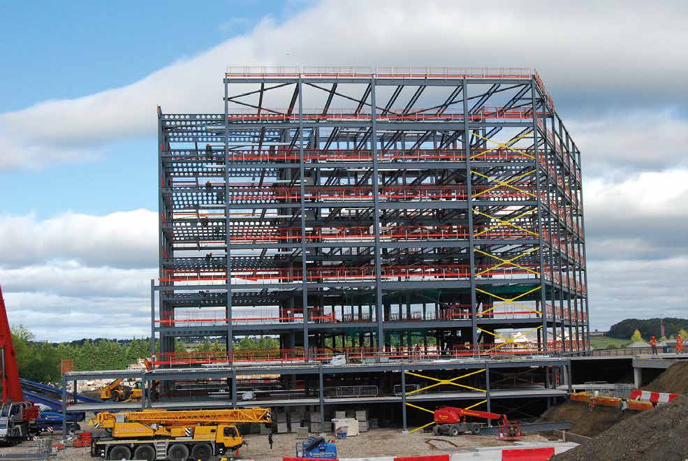 Steel erection begins on the two-level podium that abuts the building along two elevations