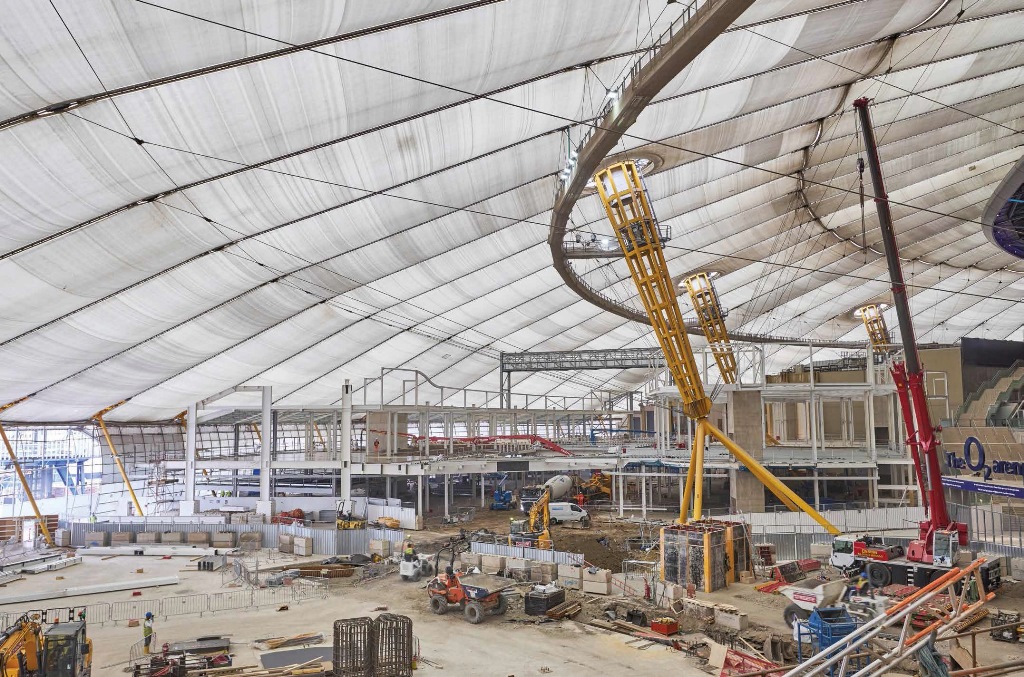 Construction progresses within the vast dome