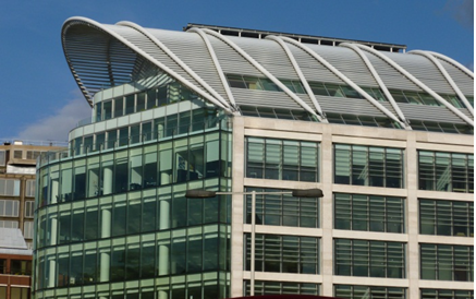 Inclined tubular arches used to support a glazed roof to a multi-storey office building in Victoria, London