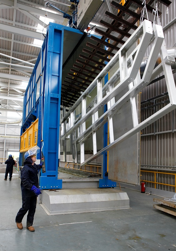 Steel elements being withdrawn from a typical hot-dip galvanizing bath