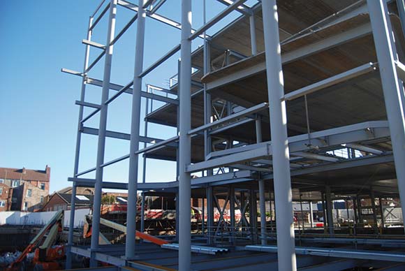 Feature CHS columns separate the office zone from the main entrance foyer