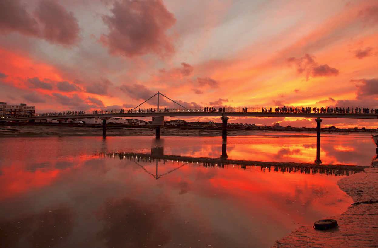 Local residents take a stroll across the River Adur during the opening day celebrations