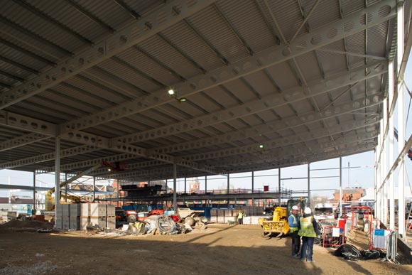 The supermarket is topped by a curved roof
