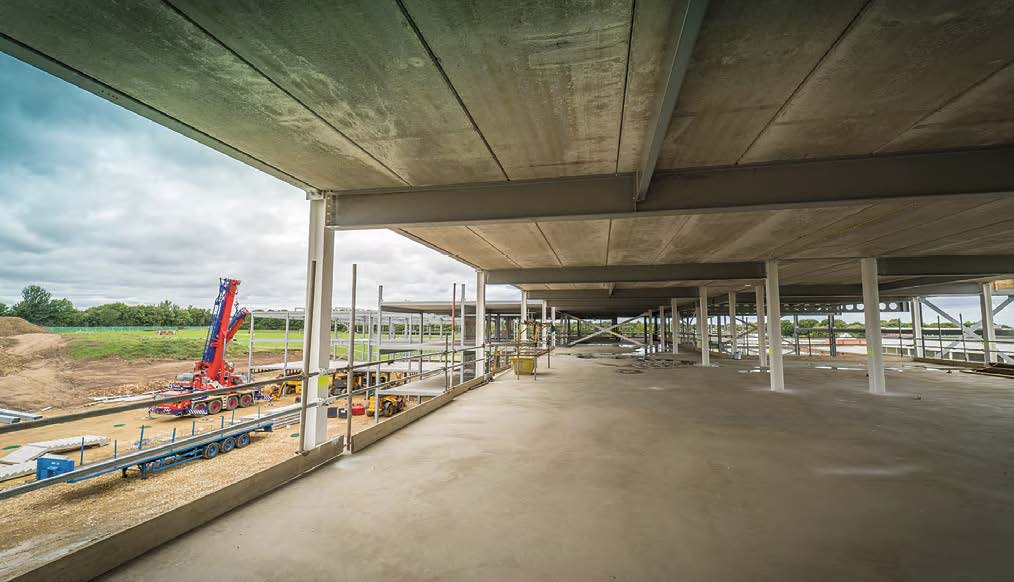 The steelwork supports precast planks to form the floors