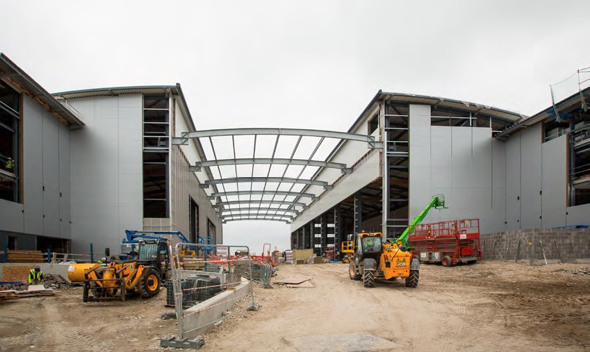 The two buildings are connected by a covered courtyard