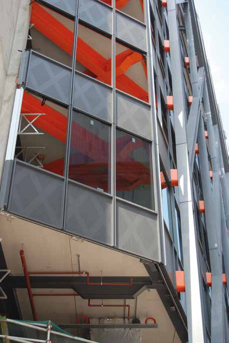 Orange shrouds cover the connections between the exoskeleton and the internal beams