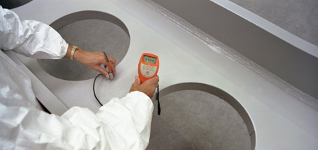 Measuring the thickness of intumescent paint on a steel beam before delivery to site