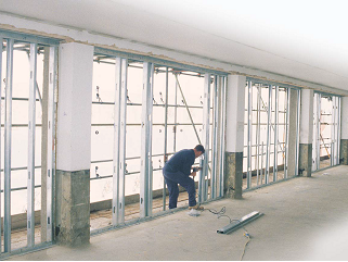Installing light steel infill walls. (Image courtesy of Metsec)