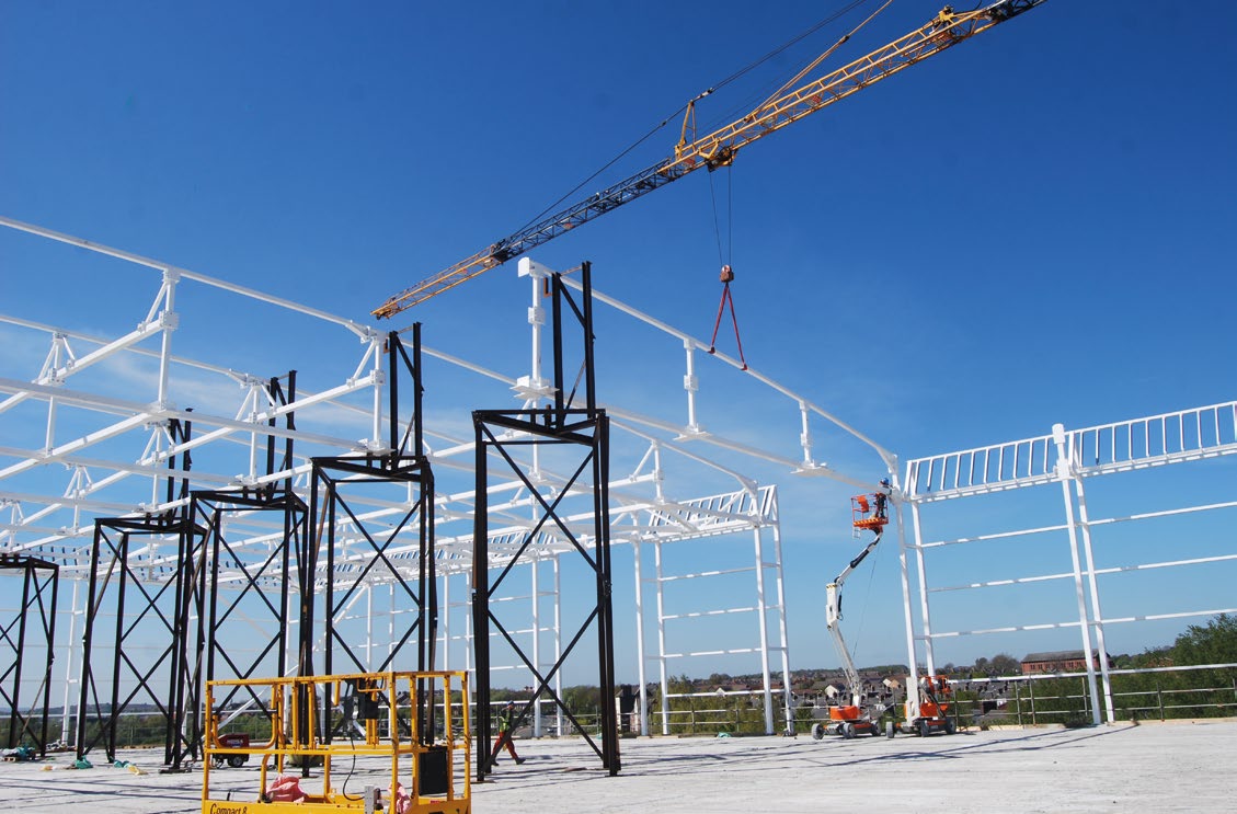 Temporary trestles support the roof trusses during installation