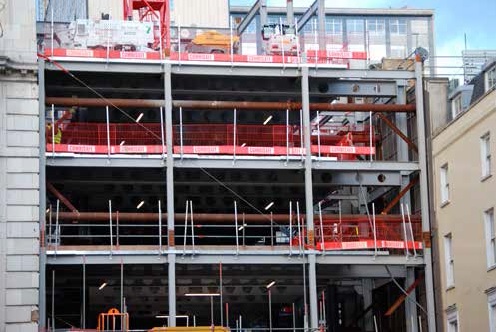 Temporary props support the adjacent buildings during construction