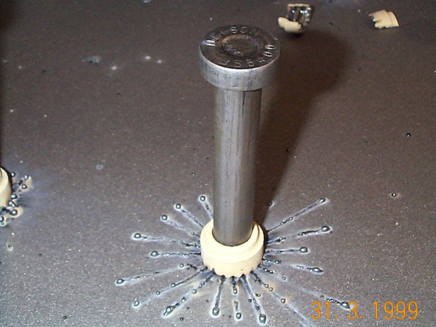 Typical shear stud connector, immediately after welding