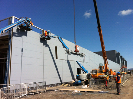 Installation of heavy cladding panels&lt;br/&gt;&#39;&#39;(Image courtesy of Duggan Steel)&#39;&#39;