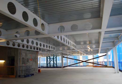 The structure features clear open plan office spaces