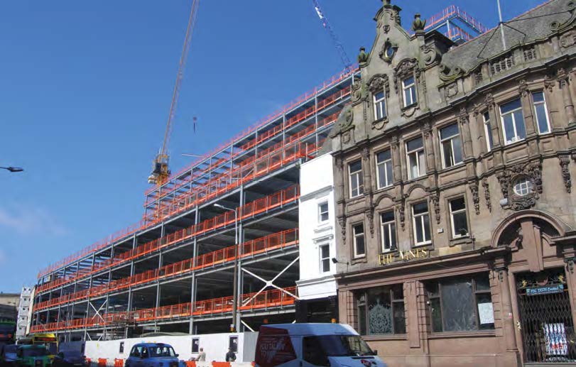The main Lime Street elevation incorporates the listed Vines pub