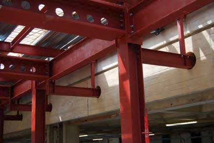 The new steelwork is bolted to the existing concrete building