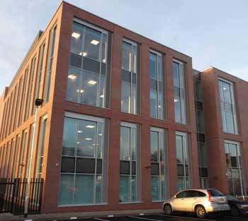 Staff parking is provided to the rear of the new building