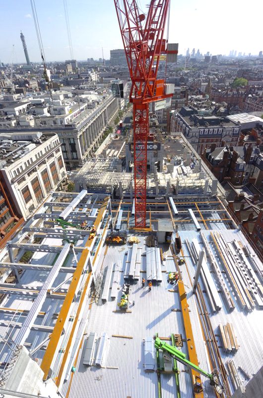 Multi-storey construction showing stair core, tower crane and metal decking (Image courtesy of Severfield plc.)