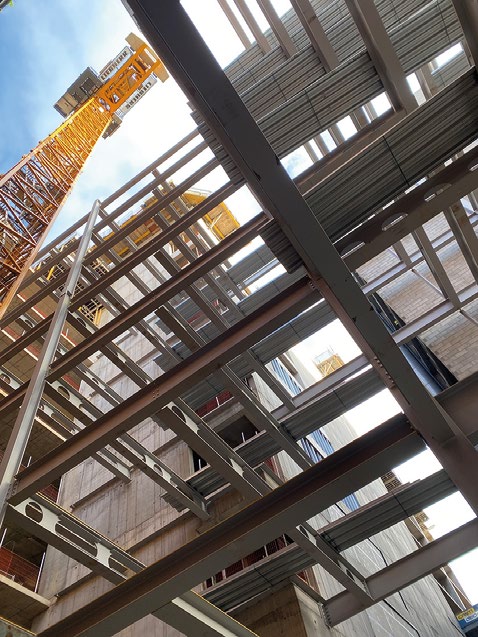 Steel beams supporting metal decking create a composite flooring solution in the steel-framed areas