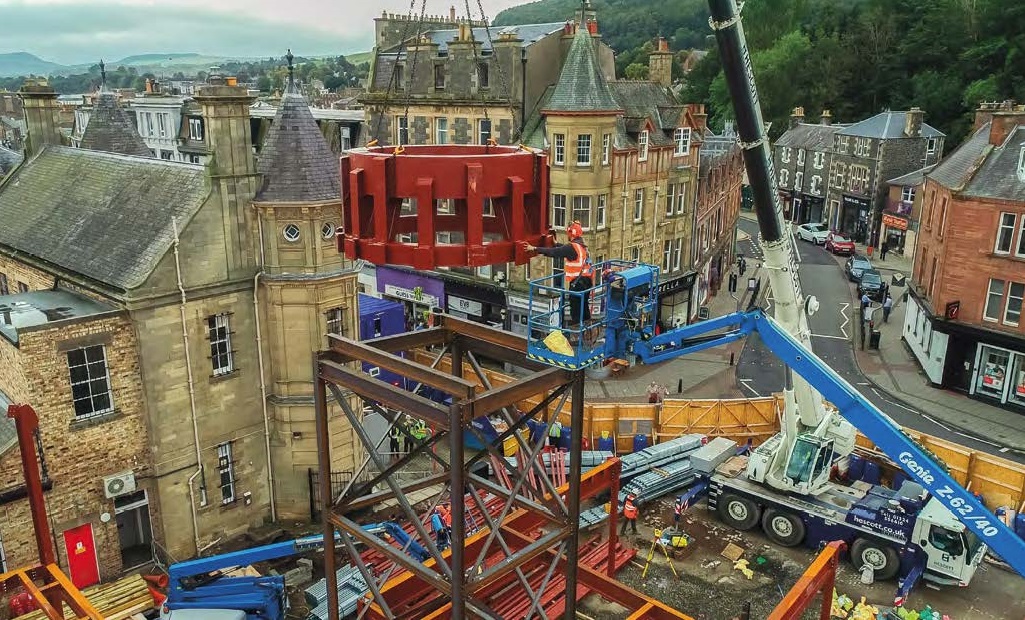 The ring beam is lifted into place and onto a temporary support