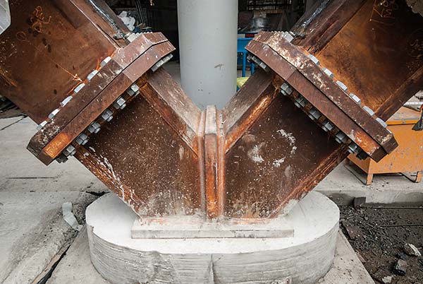 The feature V-shaped columns are connected to a 3t node at ground level