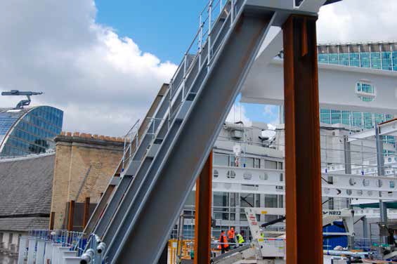 Mansards on the building’s upper floors help the structure adhere to rights-to-light requirements