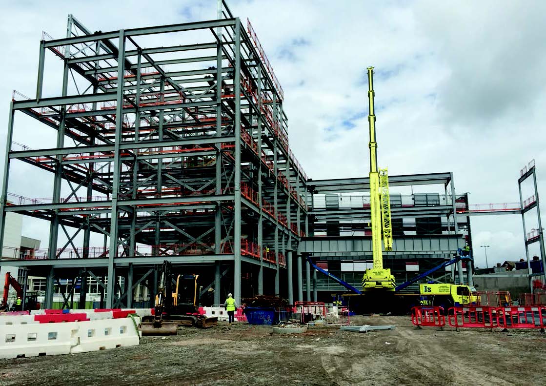 One of the four 2m deep beams forming the loading bay is lifted into position