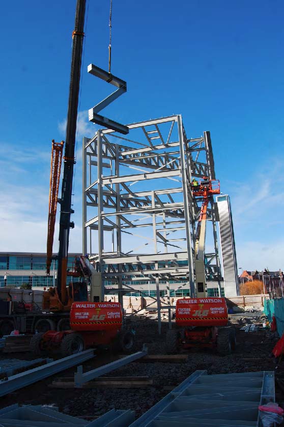 Z-shaped bracing is lifted into place