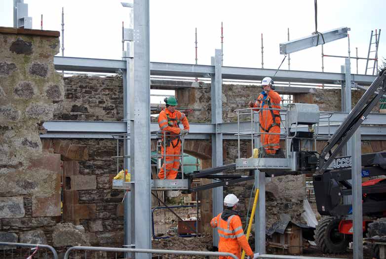 New steel elements are connected to retained stone walls